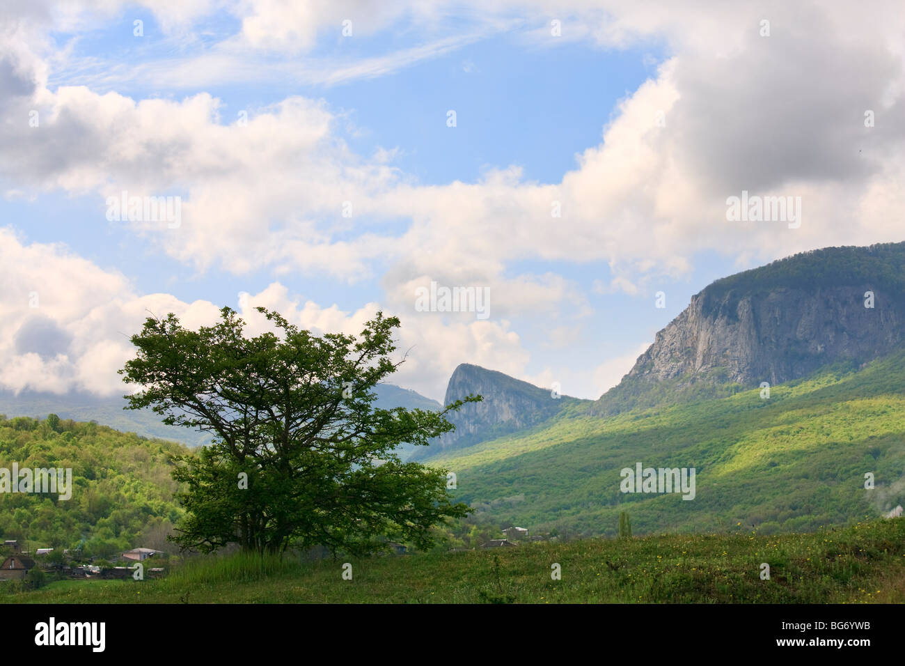 spring mountain massif landscape and village Stock Photo
