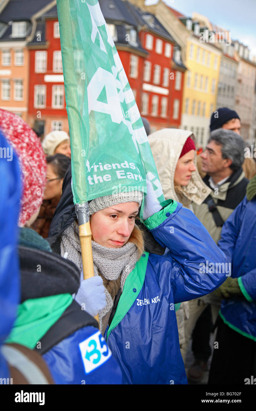 Young woman in a large demonstration in front of the Parliament building in Copenhagen at the UN Climate Change Conference. Climate march. Stock Photo