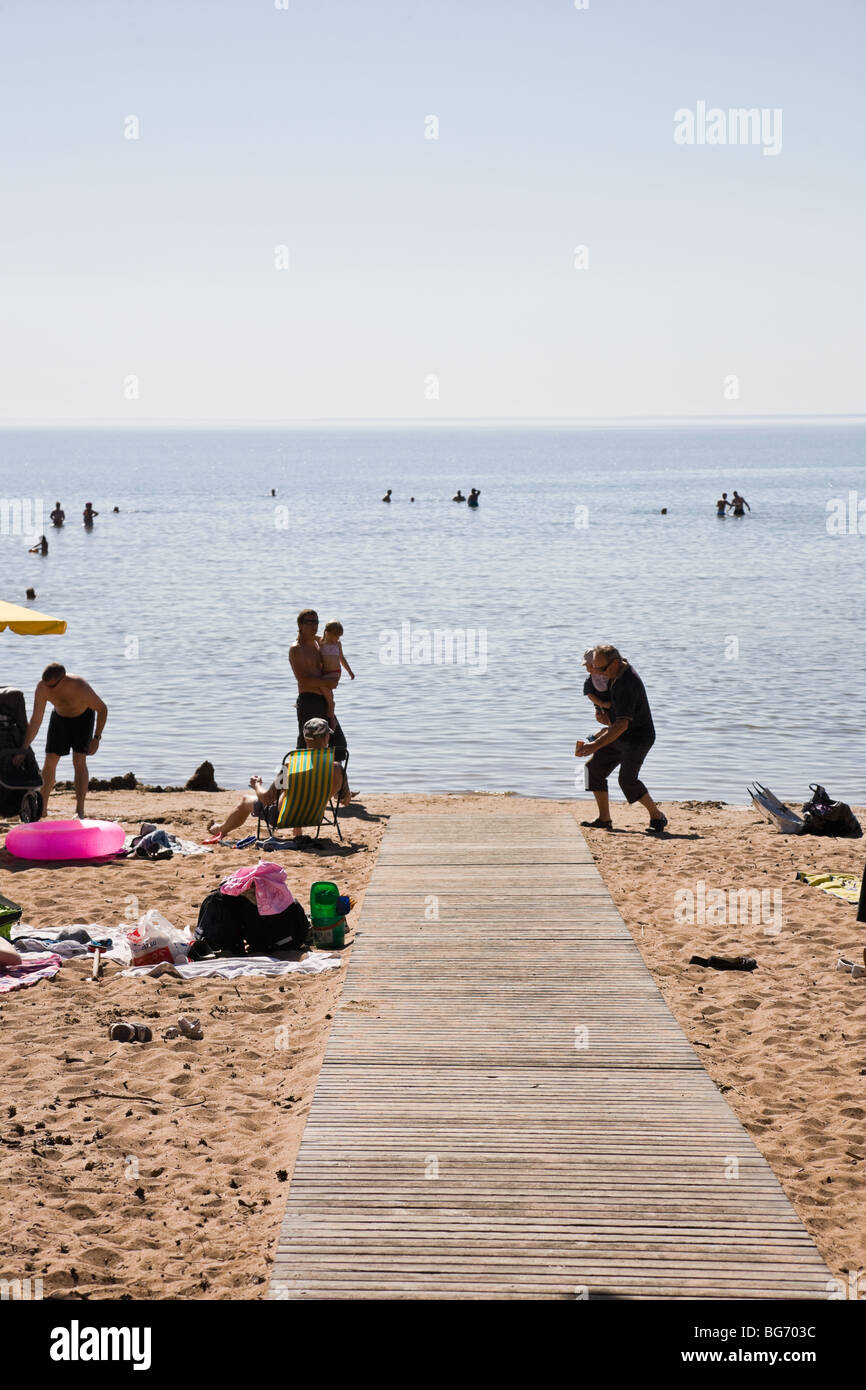 People sunbathing on the beach Stock Photo