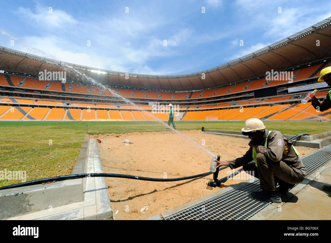 watering the pitch at Soccer City Stadium in Johannesburg, South Africa