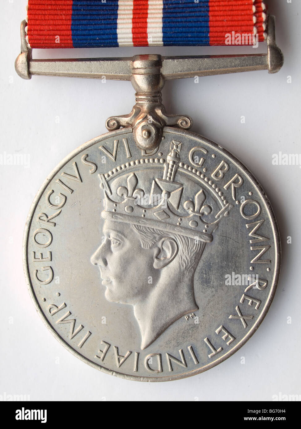 Close up of a World War 2 Medal awarded to British and Commonwealth Troops 1939-45 on a white background  Stock Photo