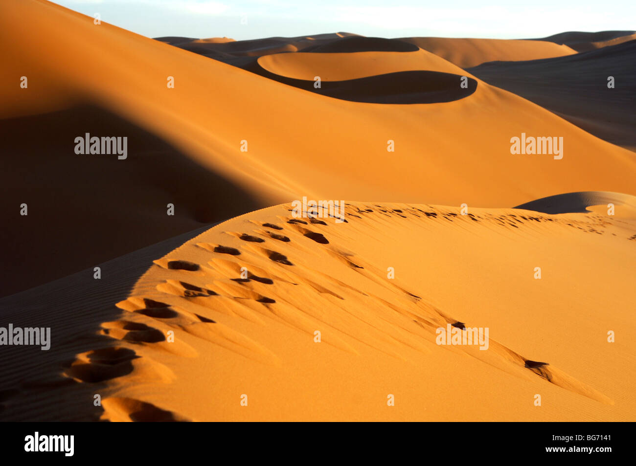Blown-over footprints in the sand dunes of Erg Muzurq, Sahara desert, Libya Stock Photo