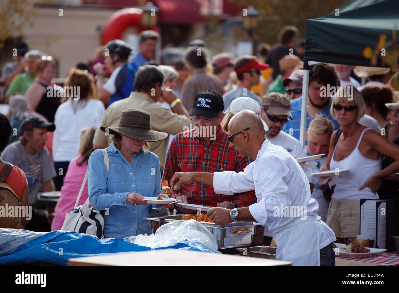 Chef serving food at an outdoor festival in Steamboat Springs Colorado