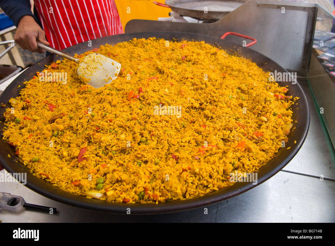Steamy hot paella being cooked on market stall at Usk Winter Festival Usk Monmouthshire South Wales UK Stock Photo