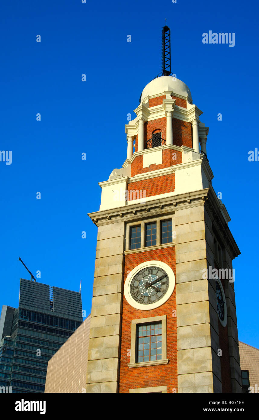 Peak of the old Clock Tower and modern high-rising in the back, Kowloon, Hong Kong, China Stock Photo
