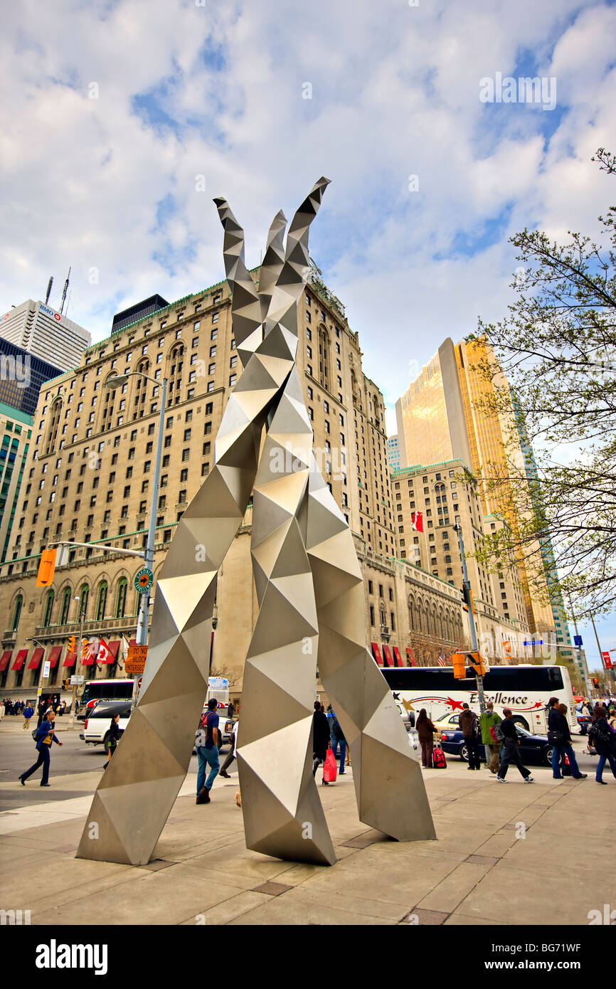 Sculpture with the Fairmont Royal York Hotel in the background, downtown Toronto, Ontario, Canada. Stock Photo