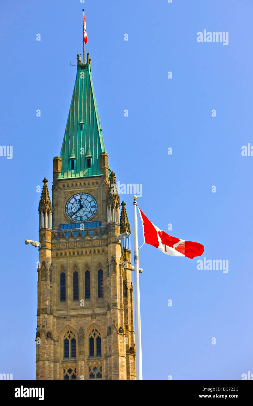 Peace Tower in the Centre Block of the Parliament Buildings and a Canadian National Flag, Parliament Hill, City of Ottawa, Ontar Stock Photo