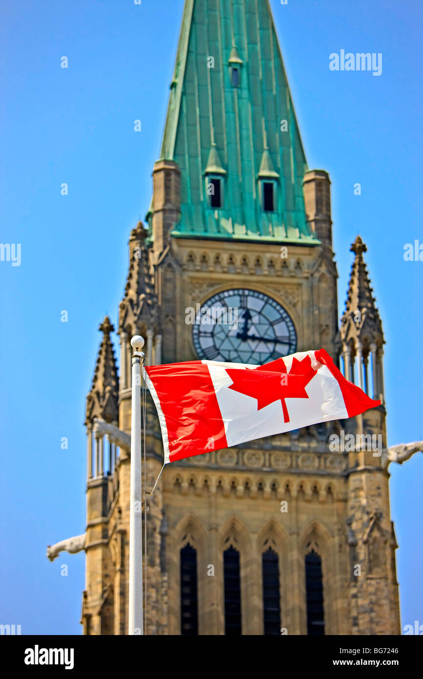 Peace Tower in the Centre Block of the Parliament Buildings and a Canadian National Flag, Parliament Hill, City of Ottawa, Ontar Stock Photo