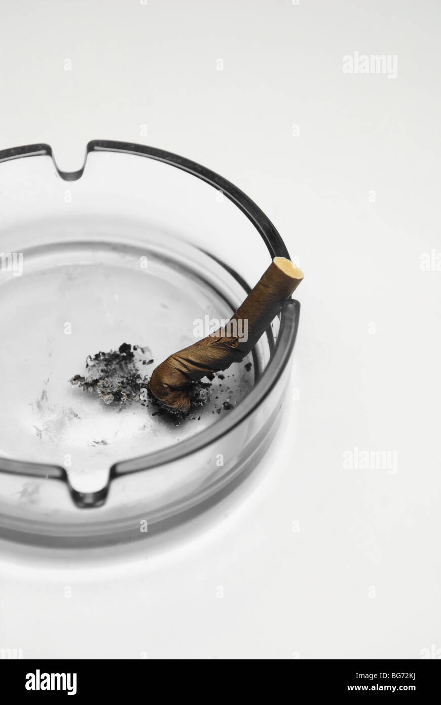 Smoking cigarette in an ashtray Stock Photo