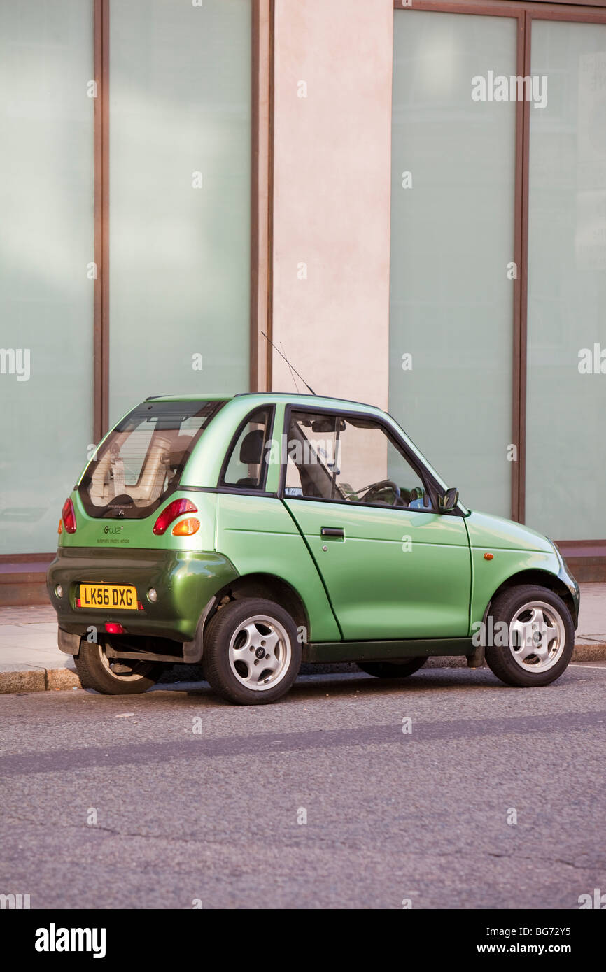 A G-Wiz electric car on the streets of London, UK. Such zero emission vehicles help to combat climate change. Stock Photo