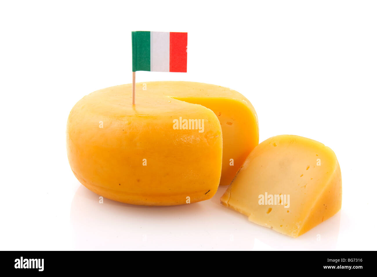 Whole yellow big cheese with Italian flag Stock Photo