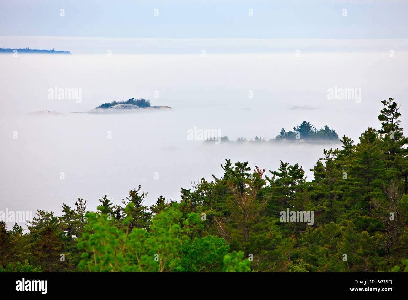 Lake Superior shrouded by fog near Lizard Island, Lake Superior Provincial Park, Ontario, Canada. Stock Photo