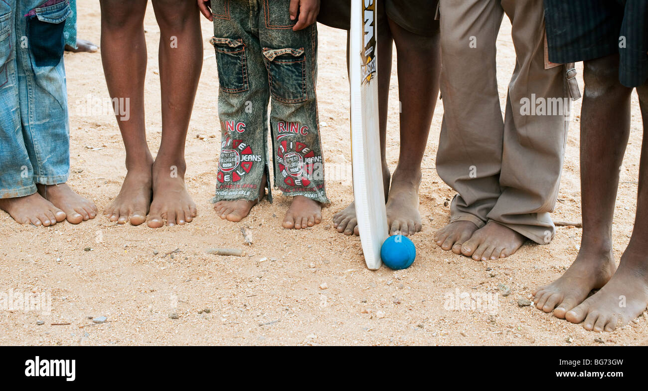 Rural Indian boys with cricket bat and ball. Nallaguttapalli, Andhra Pradesh, India Stock Photo