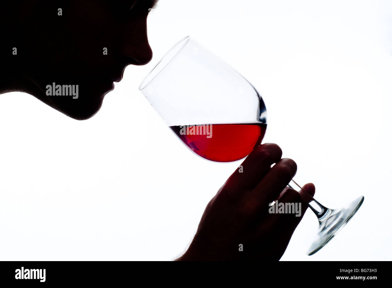 man smelling glass of red wine Stock Photo - Alamy