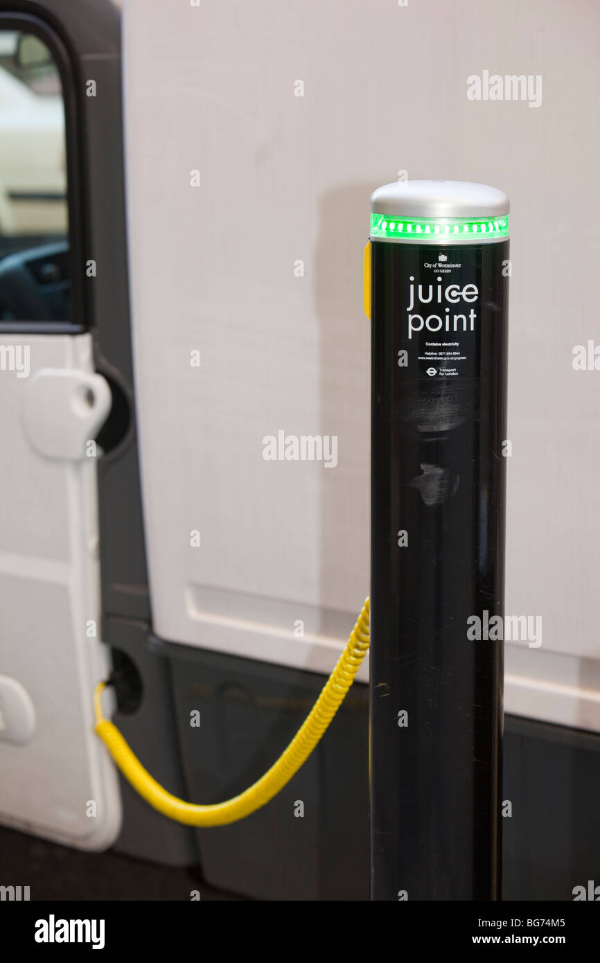 A Mega van electric vehicle re charging at a Juice Point electric vehicle charging point in westminster, london, UK. Stock Photo
