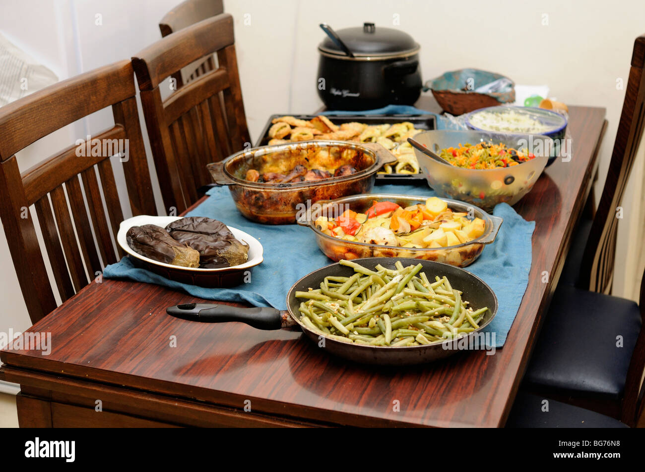 A table set with various dishes of Mideastern salads Stock Photo