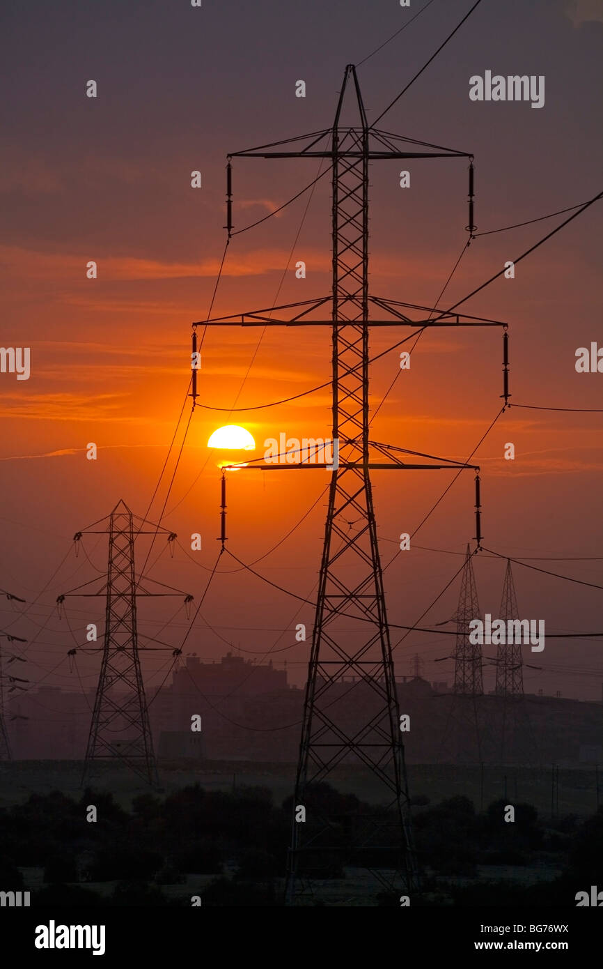 electricity power supply pylon against setting sun, Cairo, Egypt Stock Photo Alamy