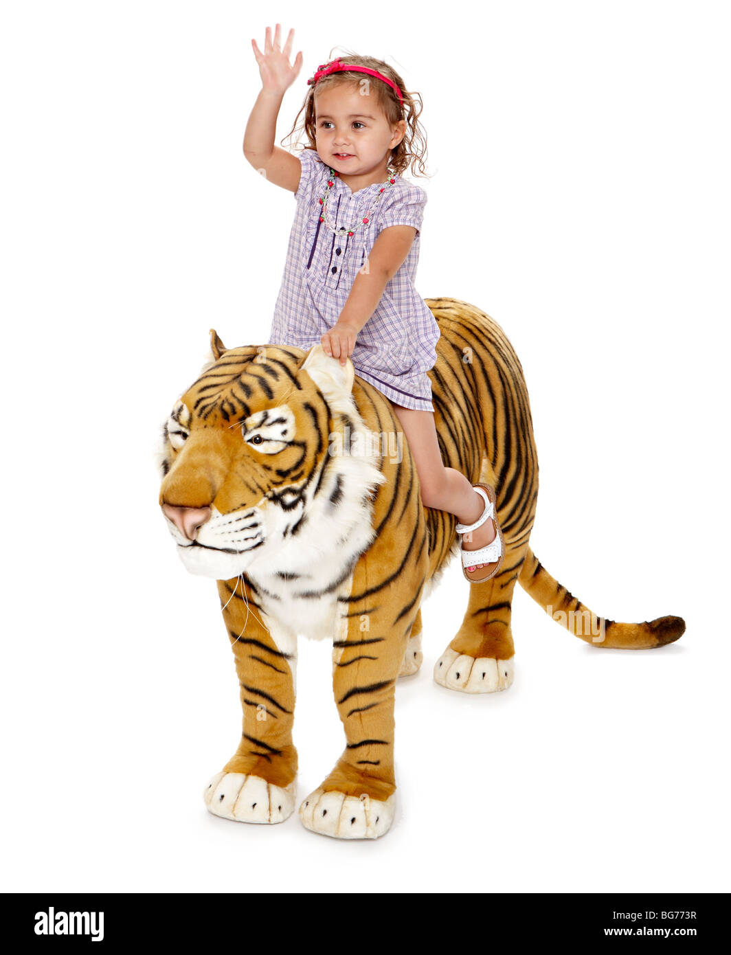 Large Toy Tiger Hannah riding Stock Photo