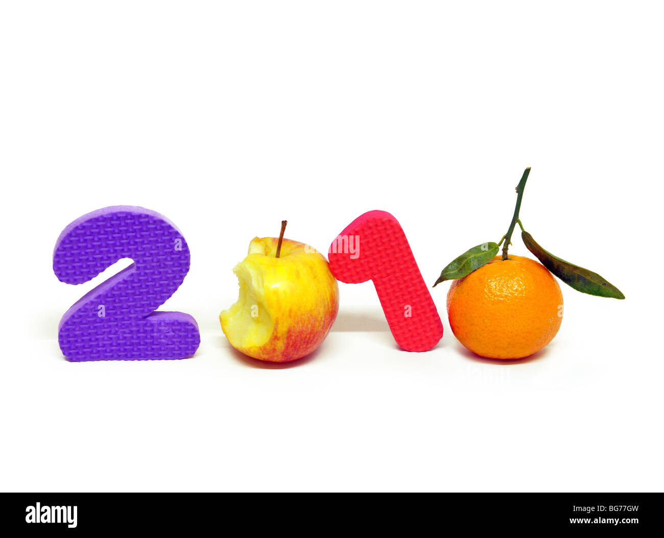 the year 2010 made up with numbers, an orange and an apple. Stock Photo