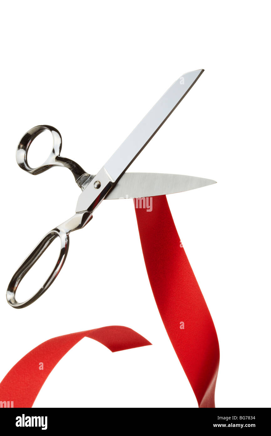 Silver Scissors Cutting Red Tape Symbolising Brexit Stock Photo
