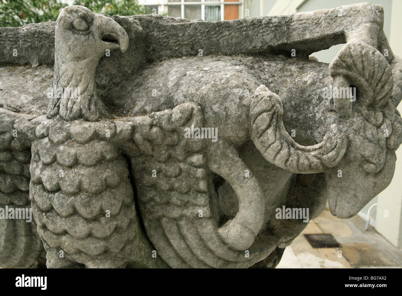Close up of Eagle's or bird's head and rams head decorating the top of an ancient column or