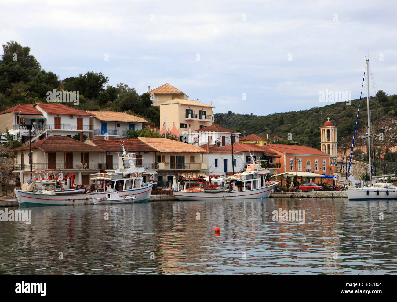 Pretty harbour of the small port town of Valthi on the Greek Island of Meganissi in the Ionian sea Stock Photo