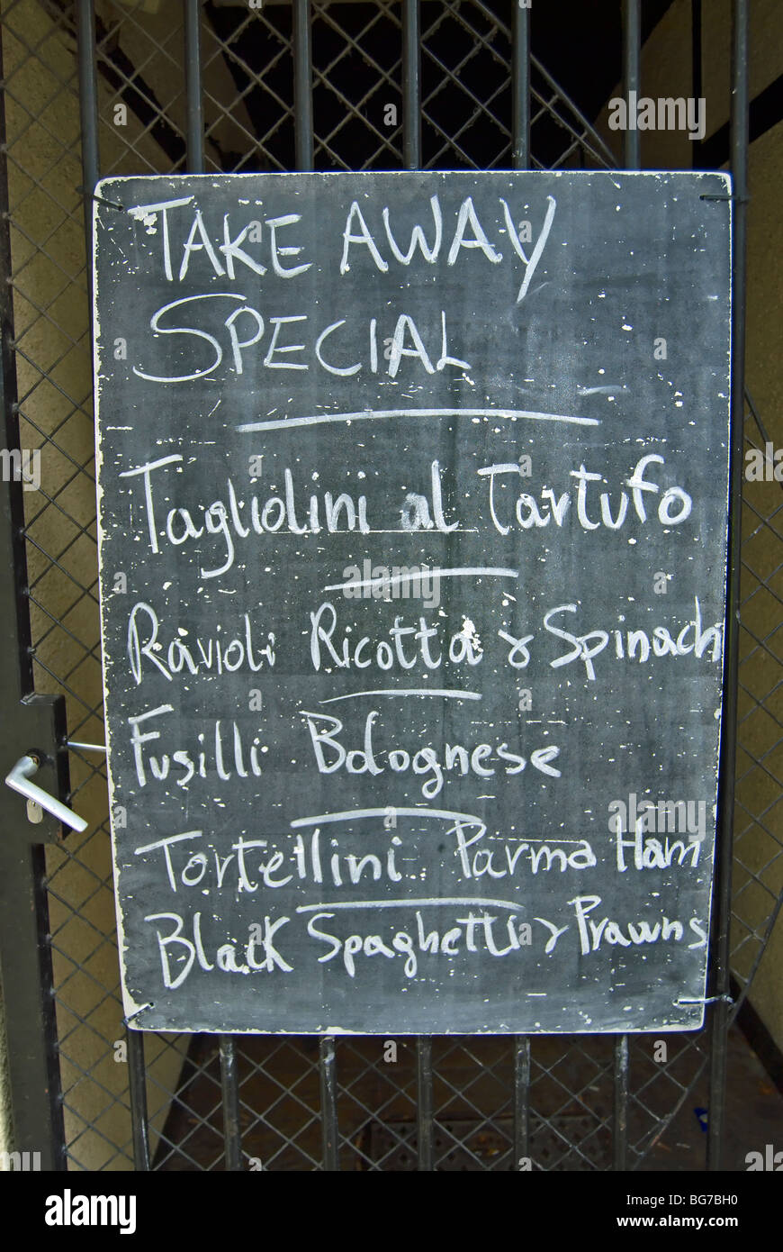 take away menu chalked onto a blackboard at an italian restaurant in kingston upon thames, surrey, england Stock Photo