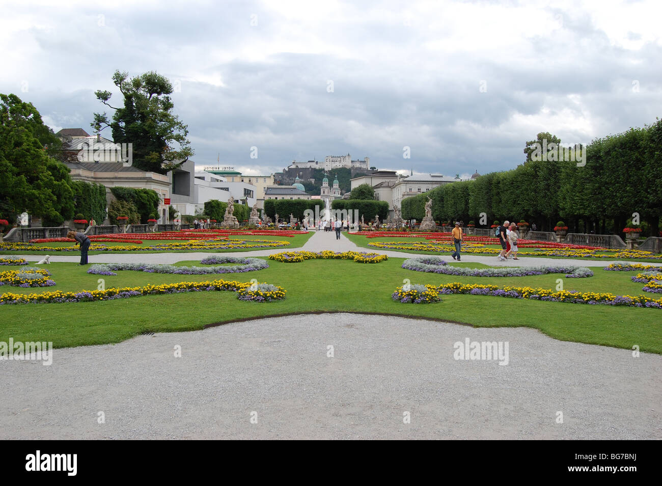 Mirabell Gardens in Salzburg, Austria, with Salzburg fortress in the background. Stock Photo