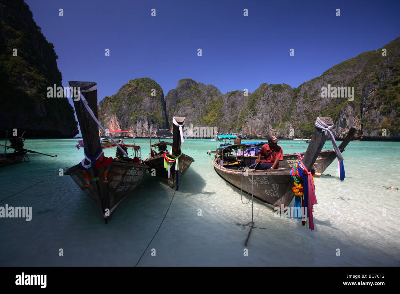 Long-tail boats in Maya Bay, Phi Phi Leh Island, Thailand Stock Photo