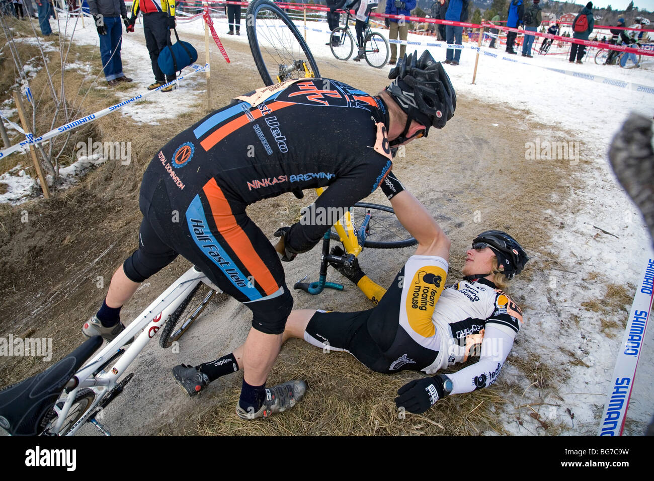 Cross racers on bicycles take part in the USA Cyclocross National Championships in Bend, Oregon on a cold, snowy track. Stock Photo
