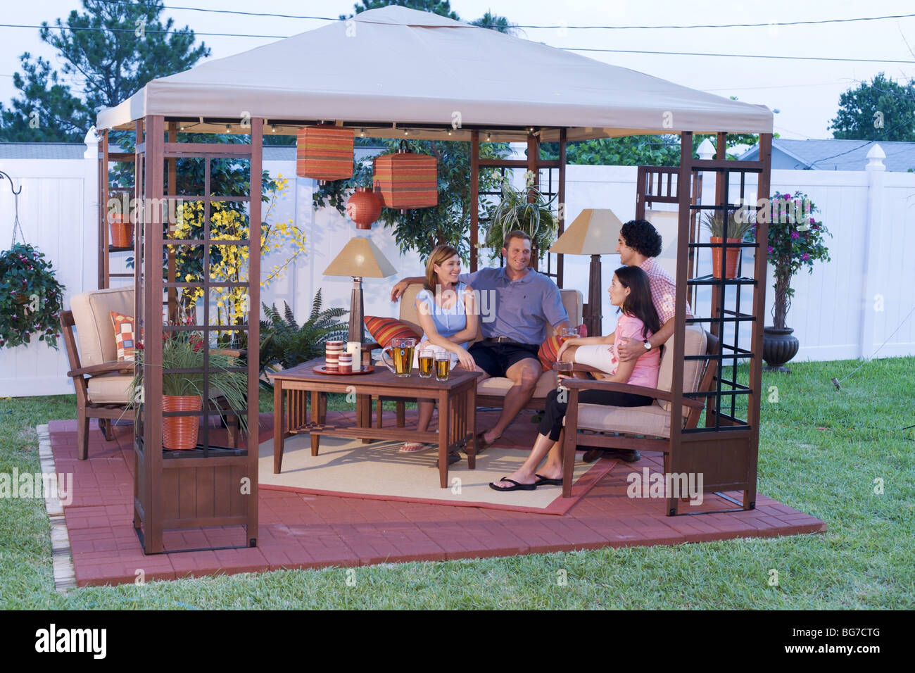 Young couples relaxing on outside deck, patio, home exterior Stock ...