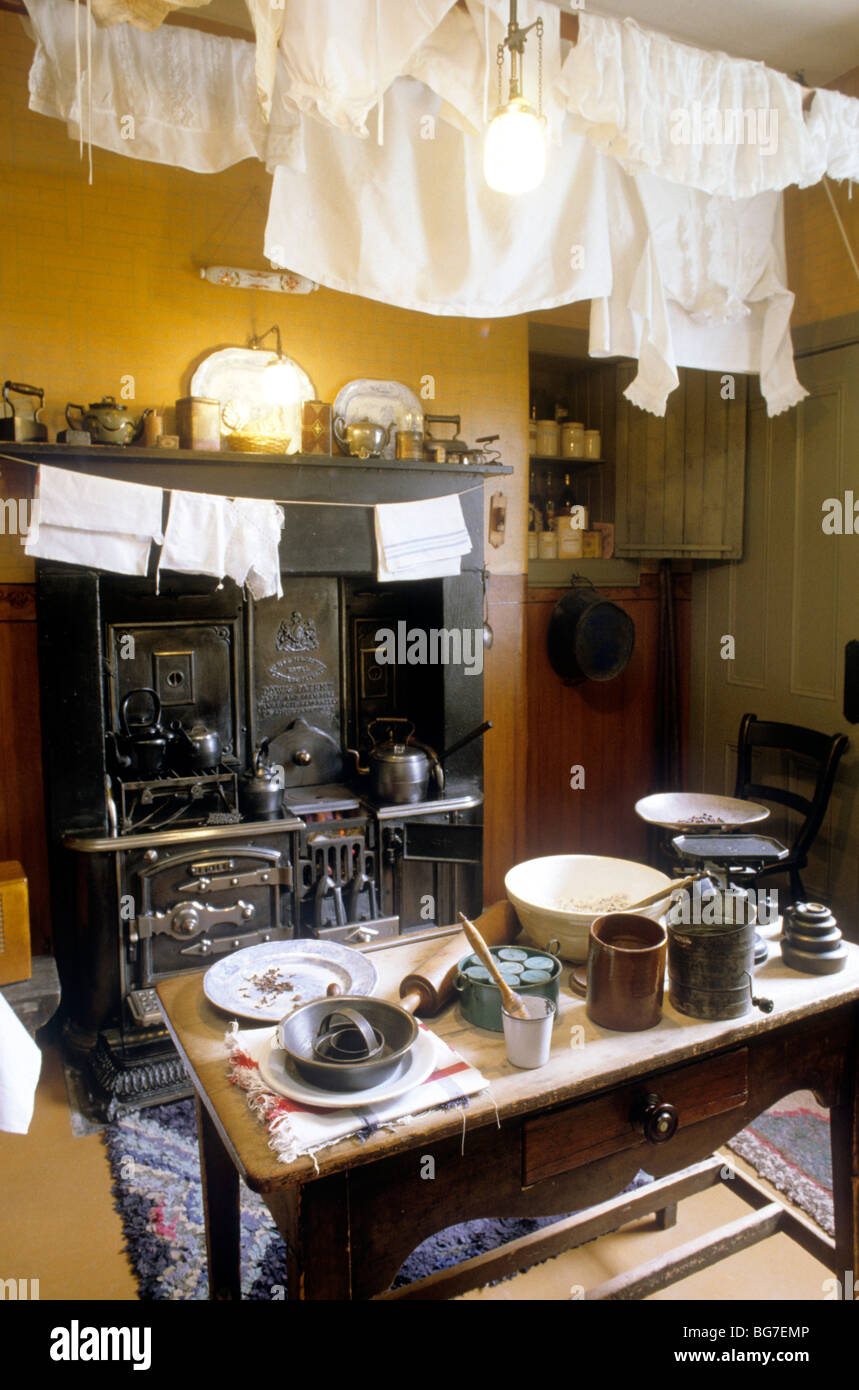 Glasgow, The Tenement House, kitchen interior Scotland UK display Victorian cooking pots utensils range Stock Photo