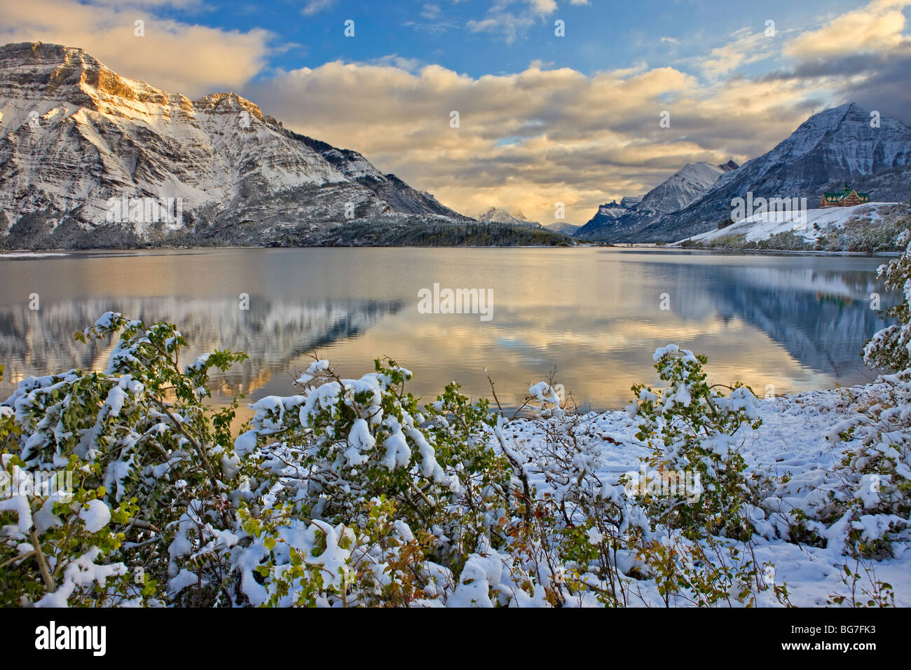 Prince of Wales Hotel opposite Mt Vimy and overlooking Middle Waterton Lake after the first snowfall of winter, Waterton Lakes N Stock Photo