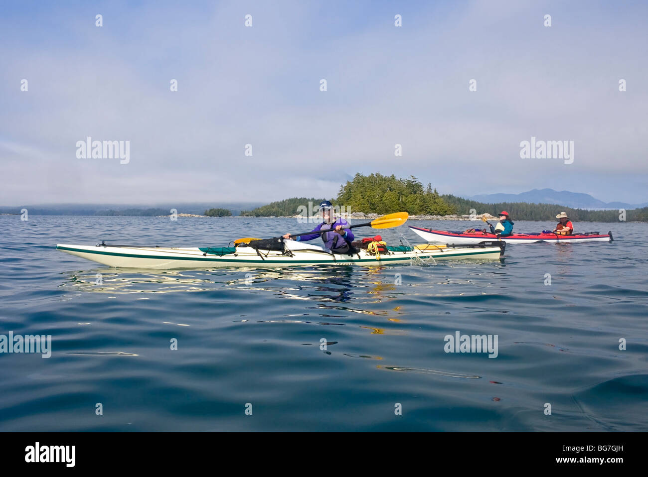 Campers paddle kayaks in the Broken Group Islands of Pacific Rim