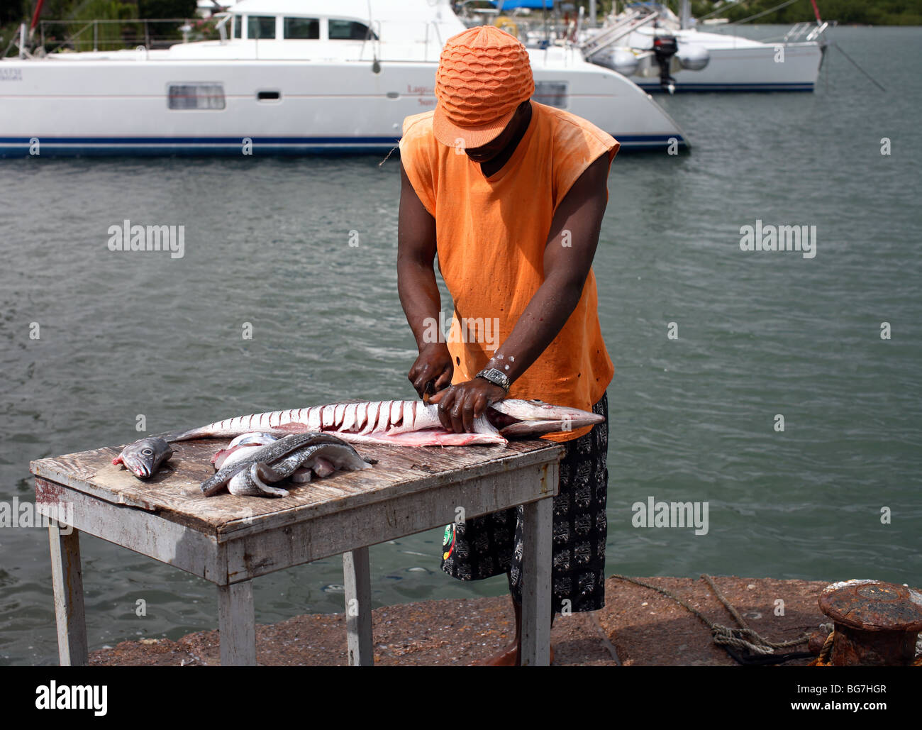 Local fisherman cutting fish Stock Photo - Alamy