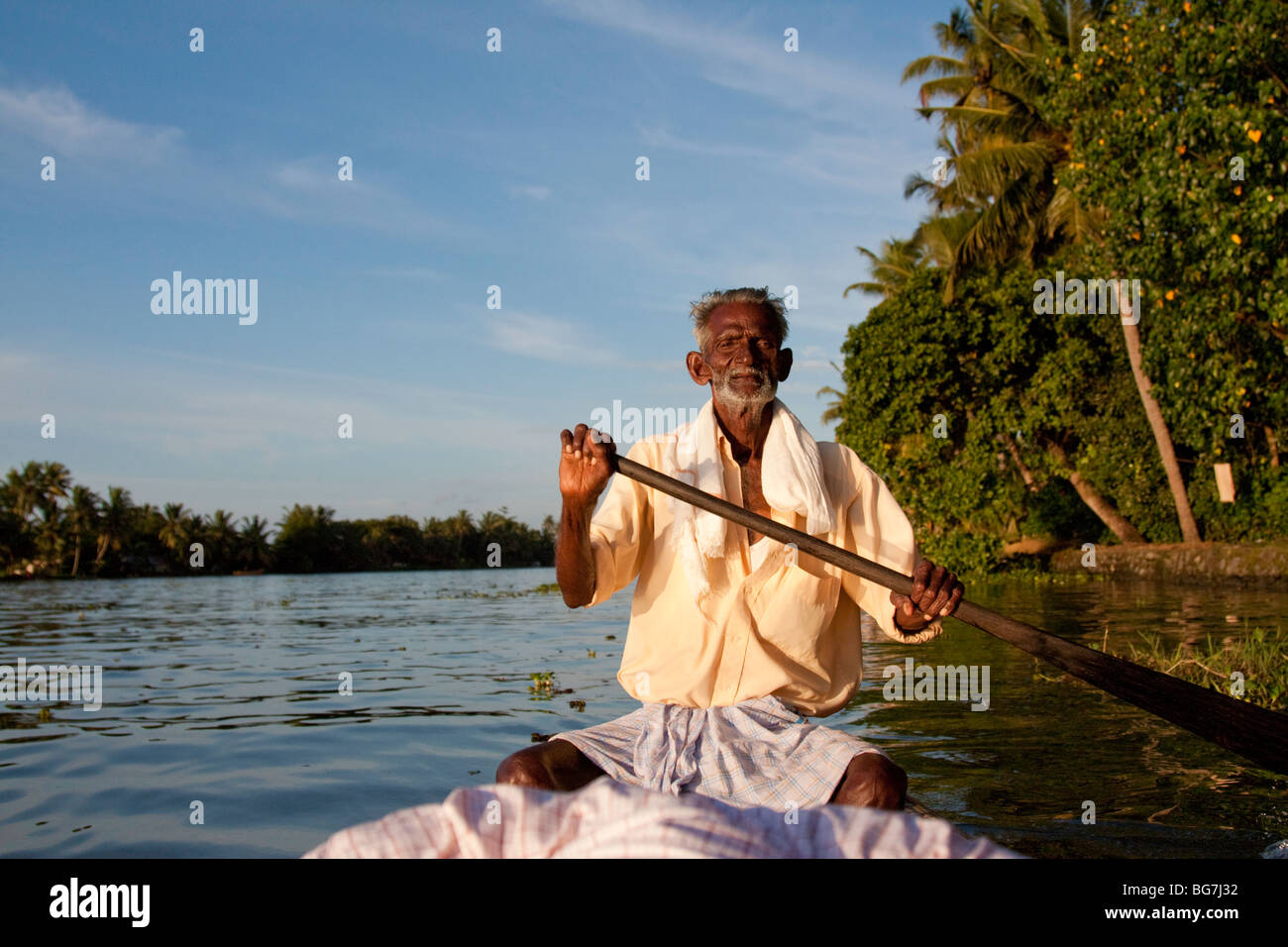 Indian man rowing boat Stock Photo Alamy