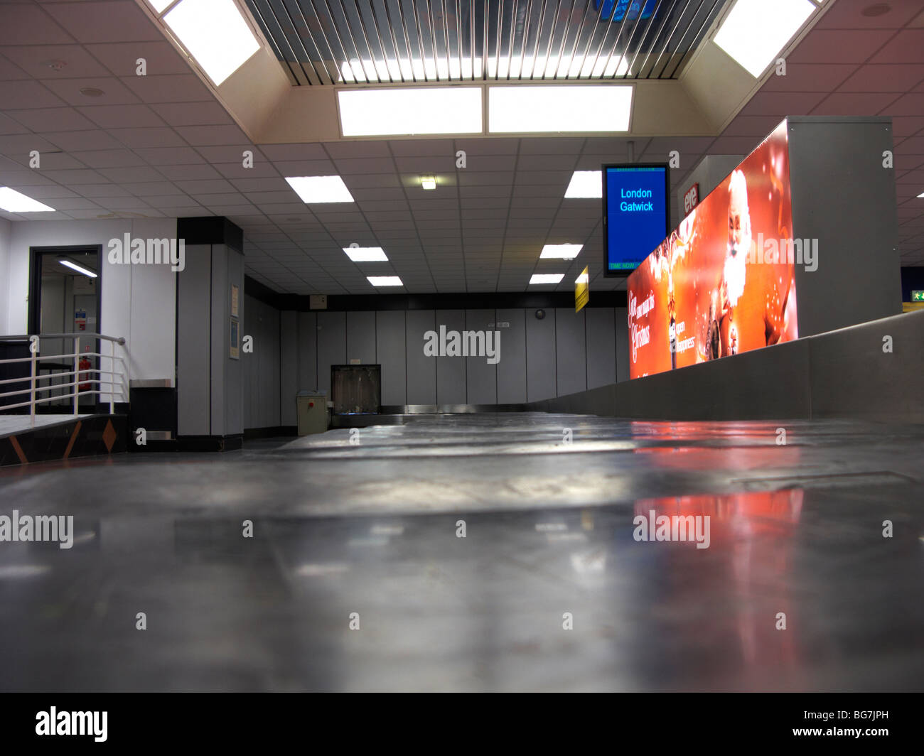 empty stopped baggage reclaim carousel at belfast international airport uk Stock Photo