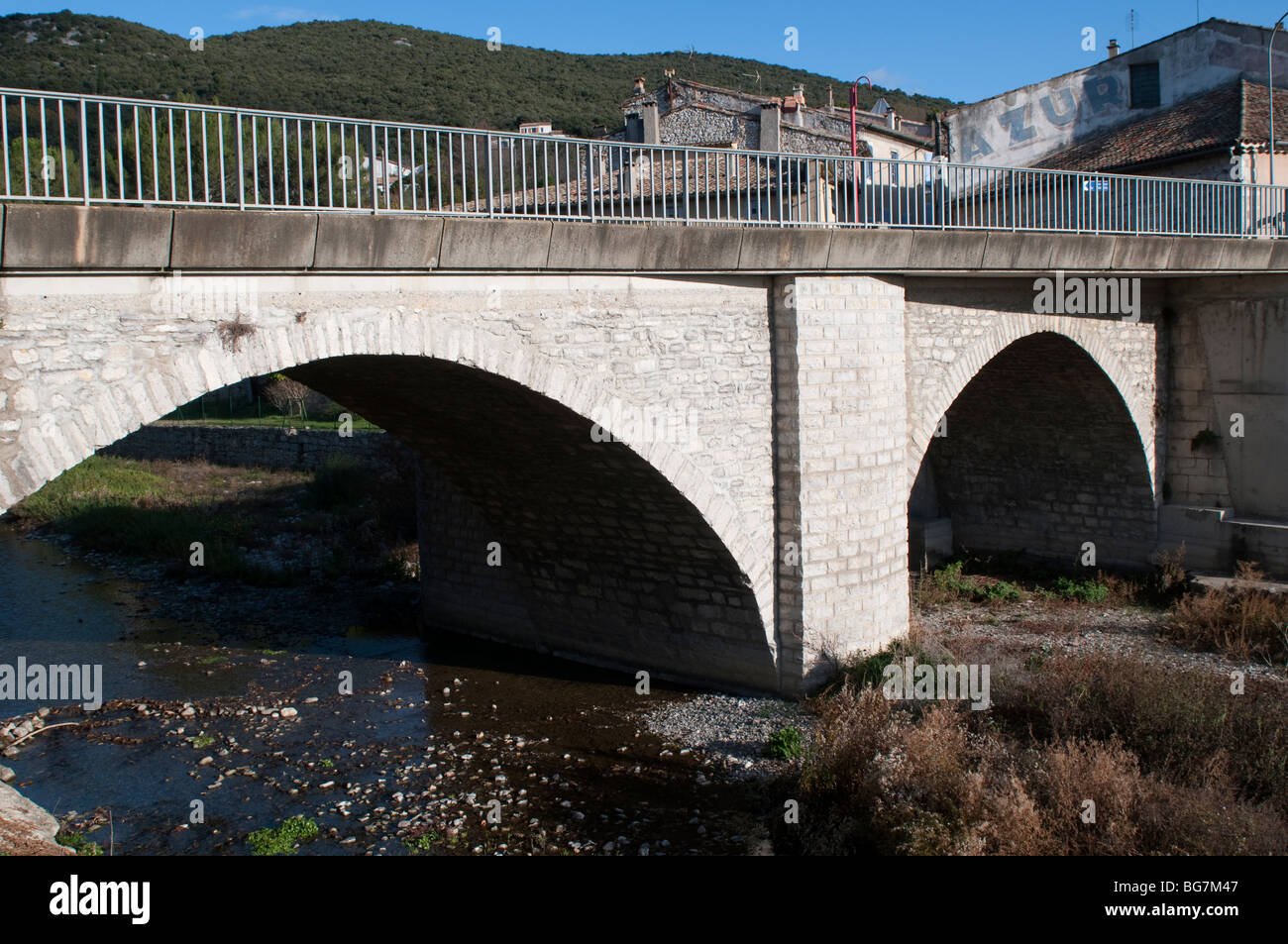 Bridge over the river, St Hippolyte-du-Fort, Gard, South of France Stock Photo