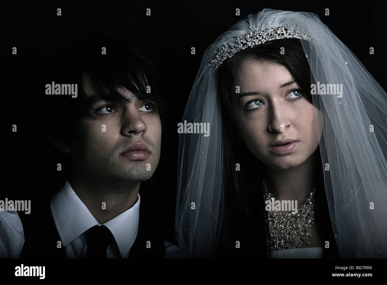 a gothic bride and groom look concerned Stock Photo