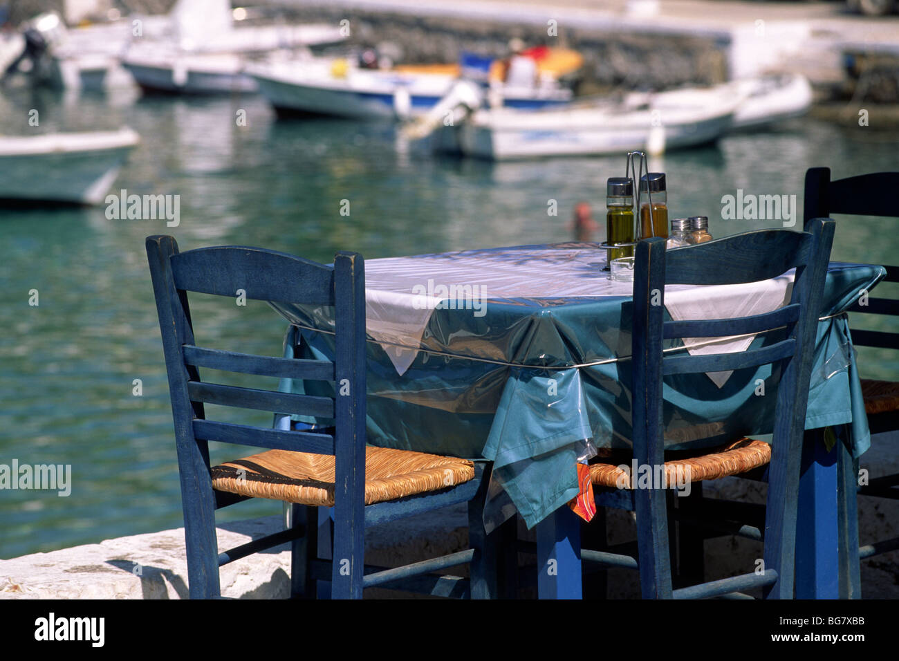Greece, Ionian Islands, Kefalonia, Assos, seaside restaurant table Stock Photo