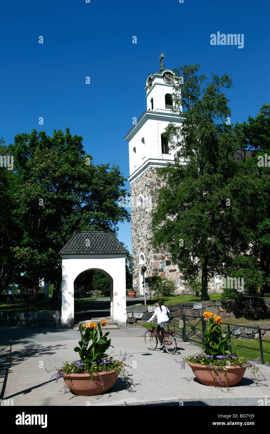 Finland, Region of Satakunta, Rauma, Historic Church, 15th-Century Stone Church of Holy Cross, Cyclist Stock Photo