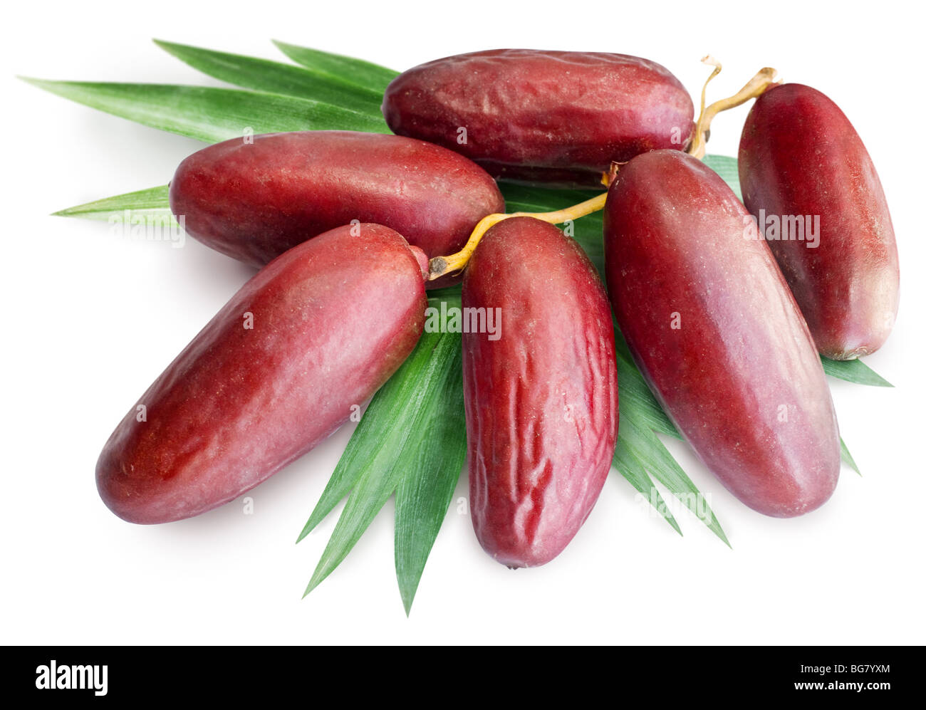 cluster of dates with leaves on a white background Stock Photo