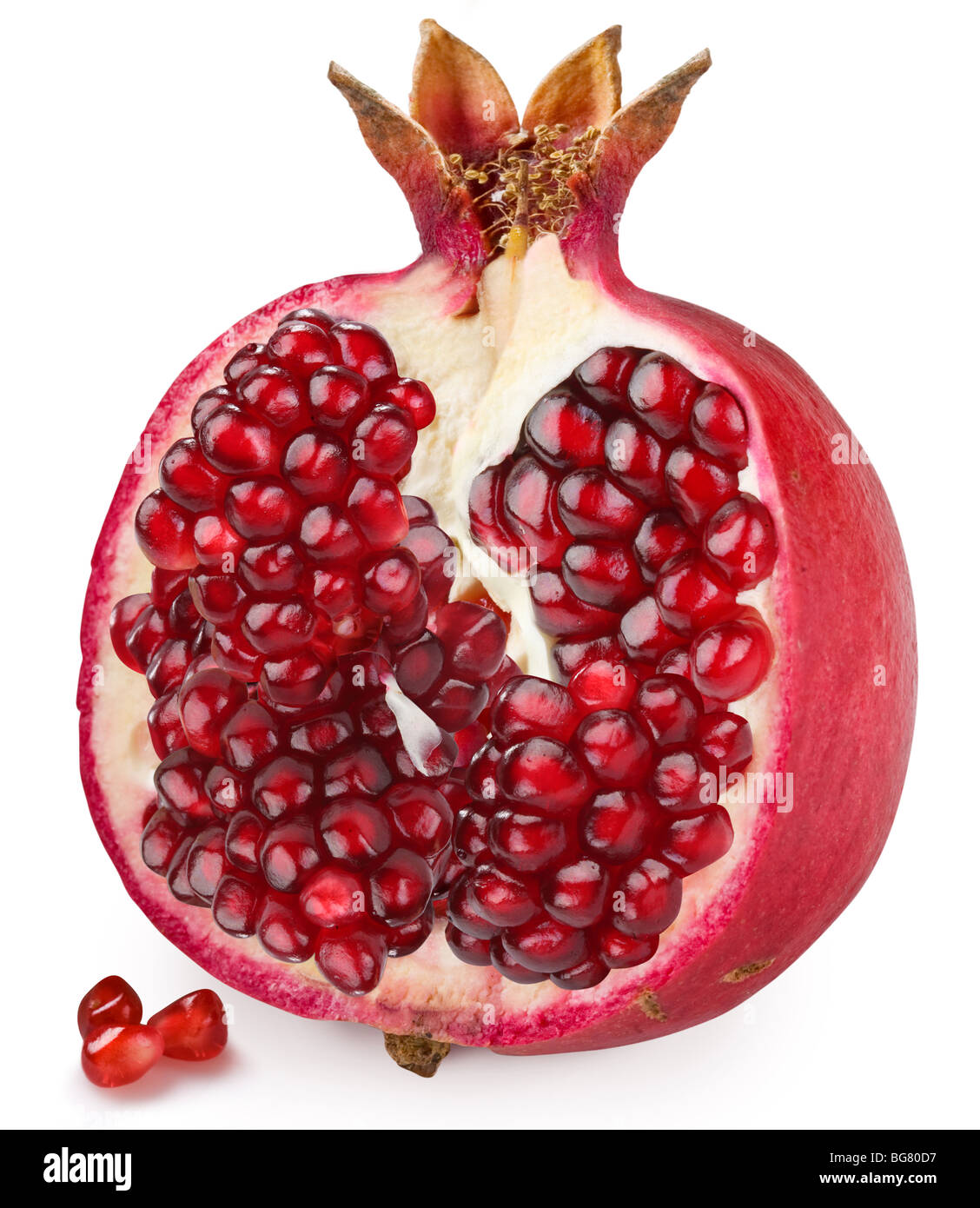 Half of pomegranate on a white background Stock Photo