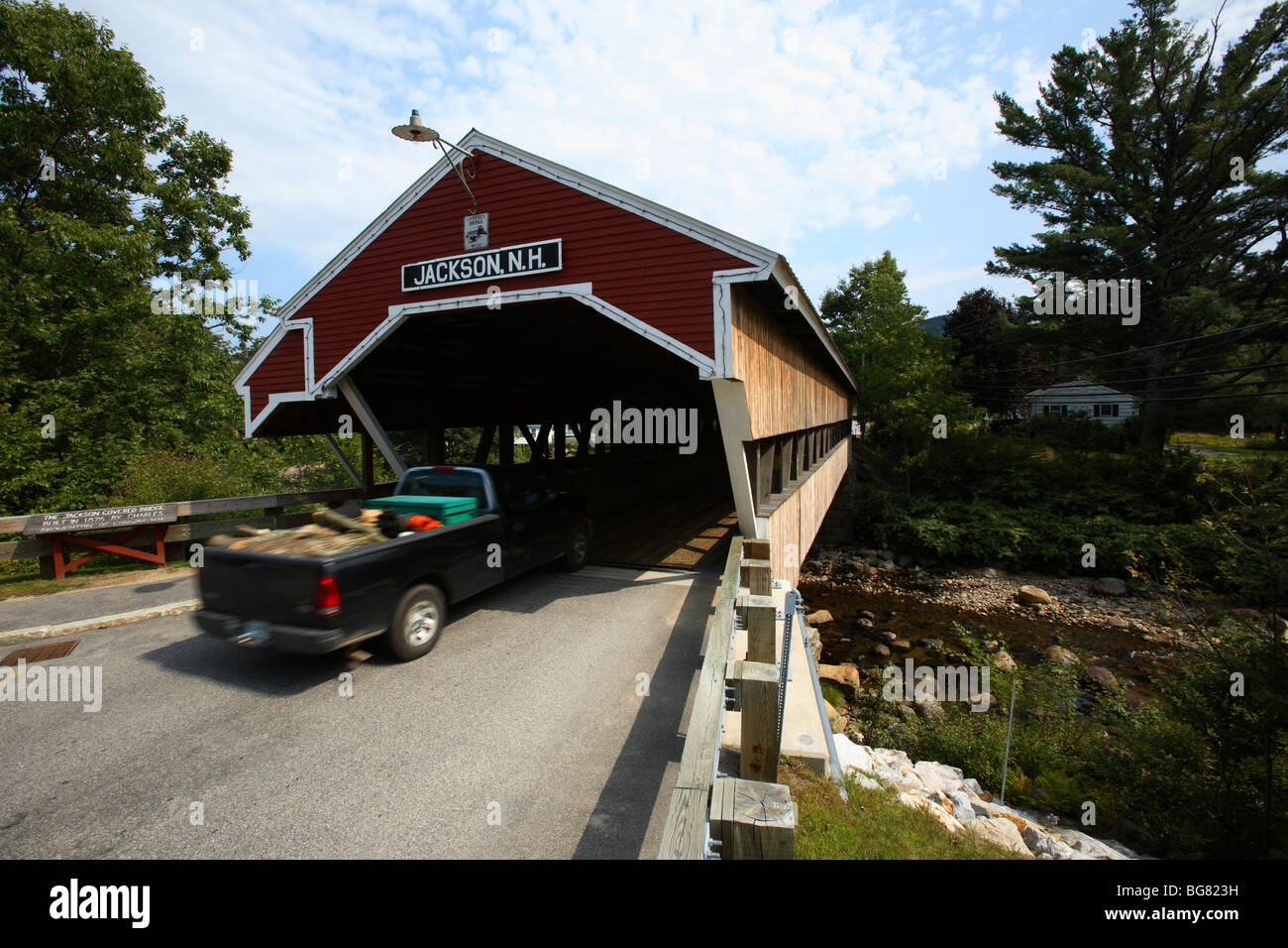 The Honeymoon covered bridge over the Ellis River is still in use in Jackson, NH Stock Photo