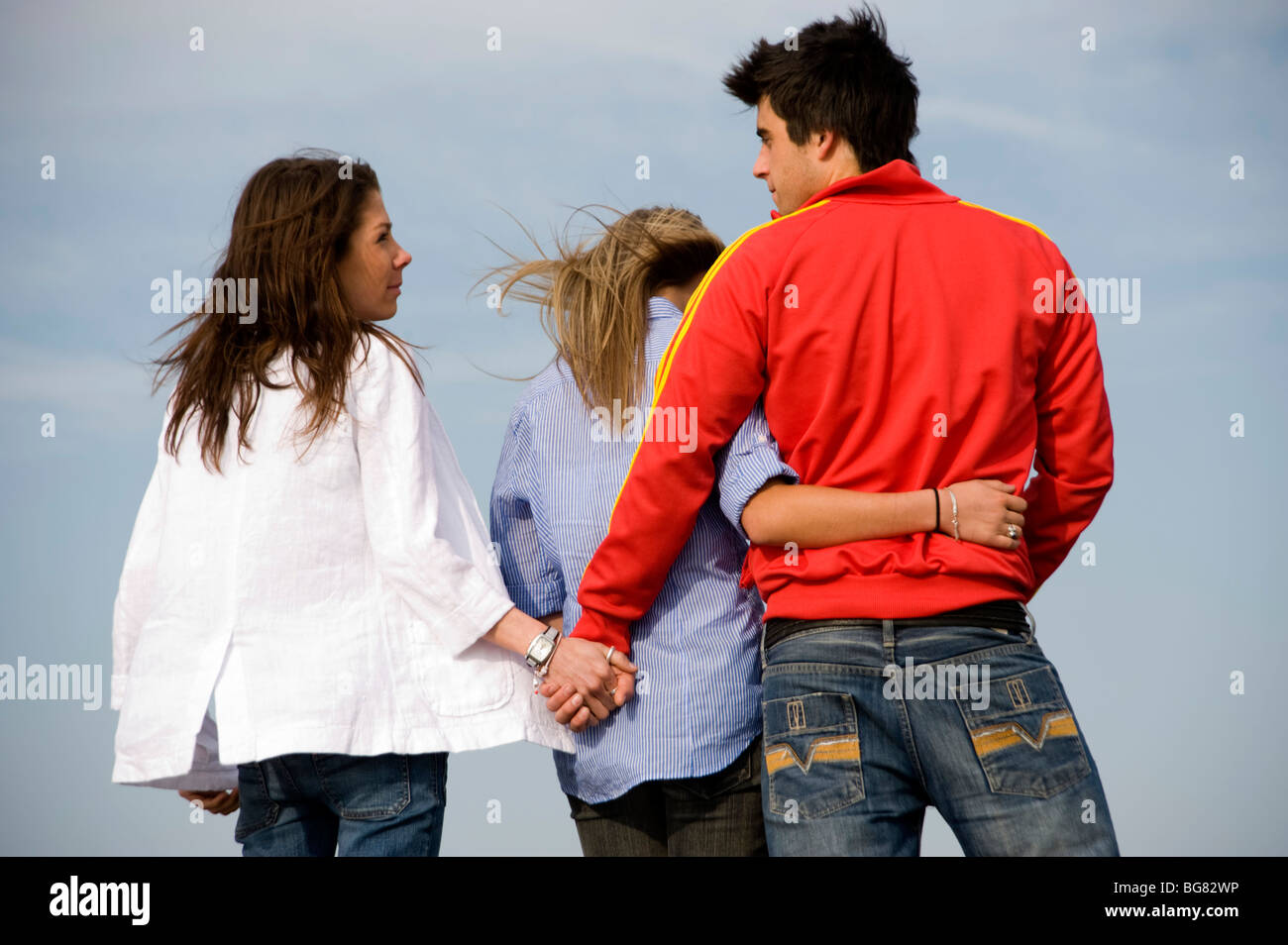 Teenage Couple Cuddling Each Other With The Boy Holding Hands With Another Girl Stock Photo Alamy Teenage Couple Cuddling Each Other With The Boy Holding Hands With Another Girl Stock Photo Alamy