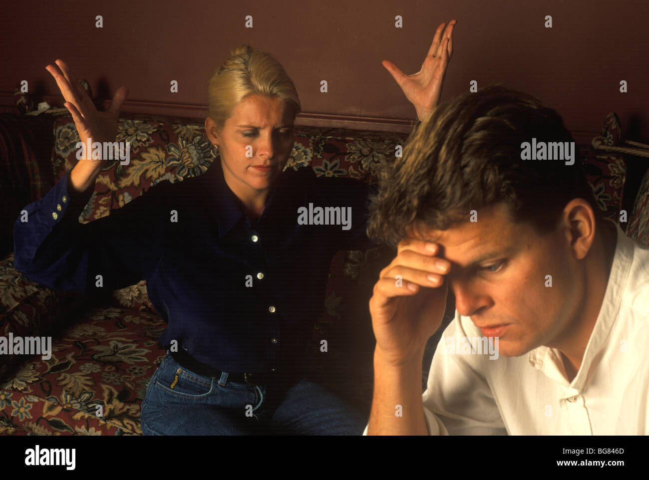 woman throwing up her hands looking exasperated with her boyfriend