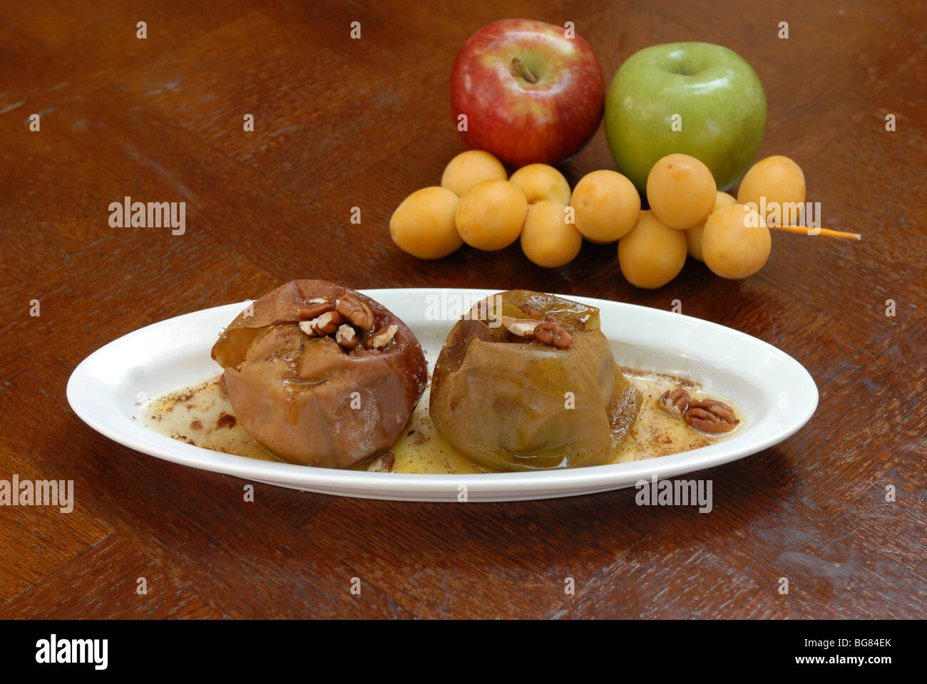 Rosh Hashana dish baked apple with honey cinnamon and dates Stock