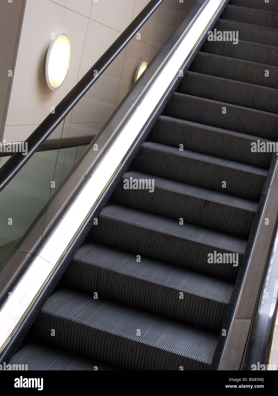 Moving escalator in shopping centre Stock Photo - Alamy