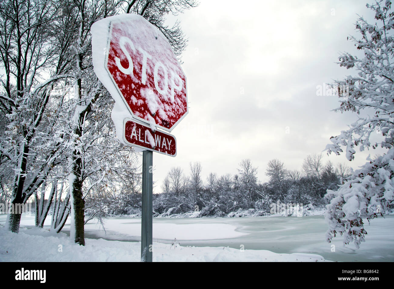 Stop sign snow trees hires stock photography and images Alamy