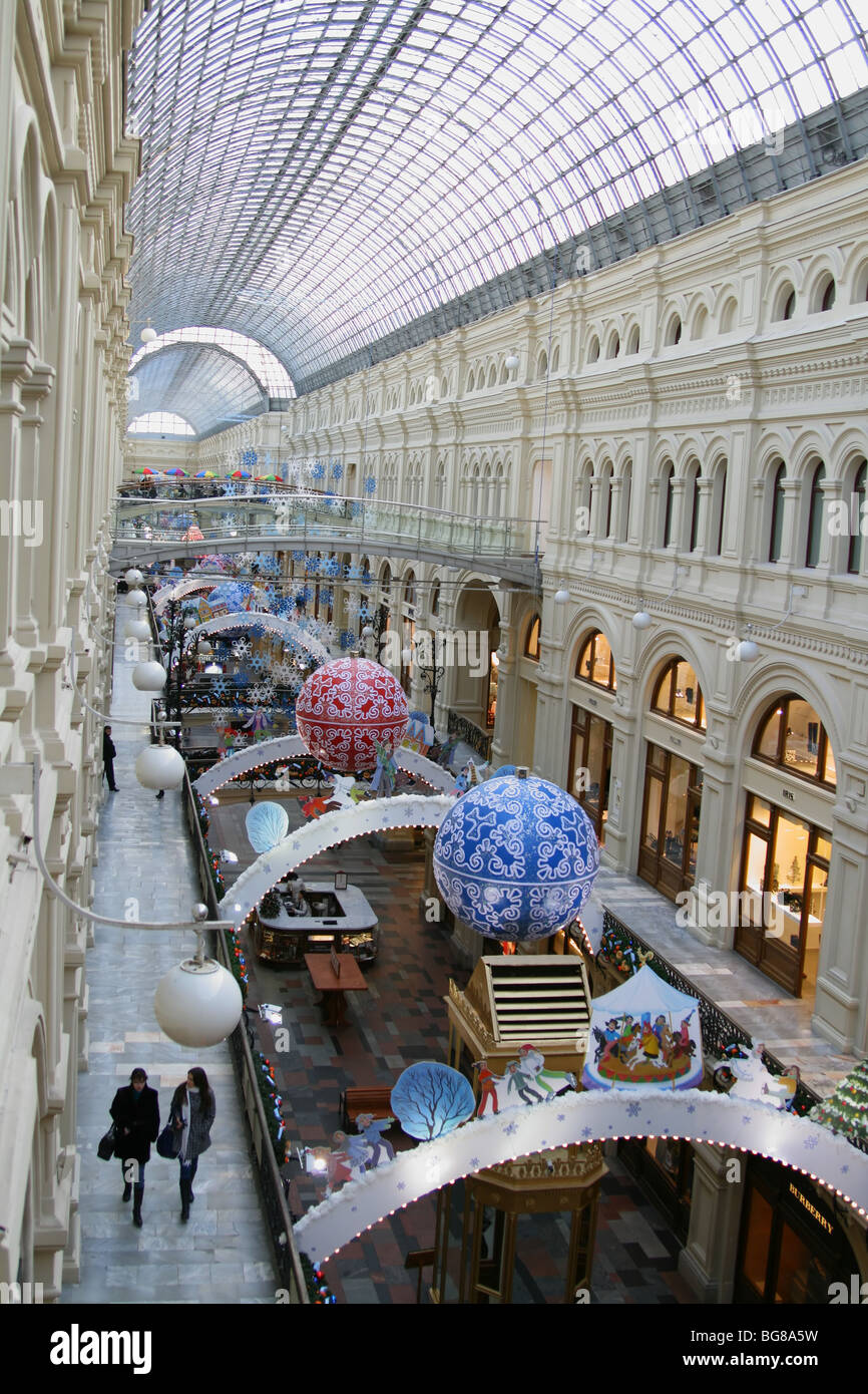 Inside view of shopping gallery in Moscow decorated for Christmas: Moscow State Department Store (GUM) located at Red square Stock Photo